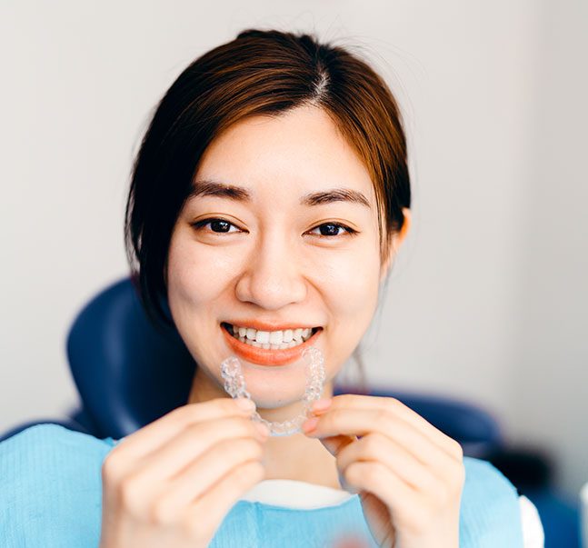 woman with clear aligner